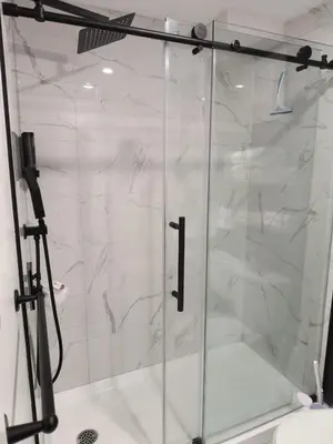 a shower with a glass door in a bathroom at ArbyManie's Place Newly Built Basement Apartment in London