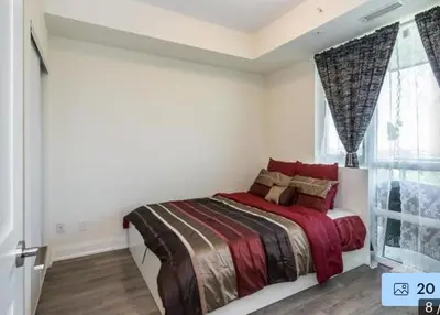 a bedroom with a bed and a window at Aseesniwas in Brampton