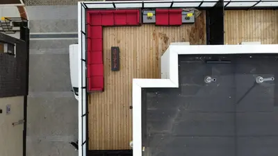a building with a door with red dividers on it at Modern Townhouse Rooftop Vibes in Oakville