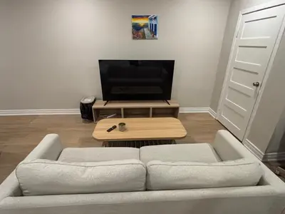 a living room with a couch and a coffee table at Beautiful apartment DT Toronto in Toronto