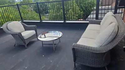 a balcony with two chairs and a table and a couch at Downtown Toronto UFT in Toronto