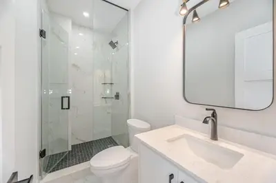 a bathroom with a shower and a toilet and a sink at Downtown Toronto UFT in Toronto