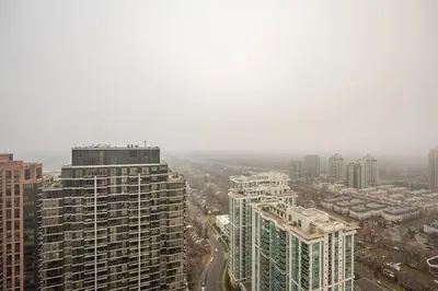 an aerial view of a city with tall buildings at Modern 1 BR Apartment in North York Free parking in Toronto