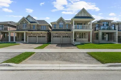 a large house with a large driveway at Heaven Beach House 2 min walk in Georgina
