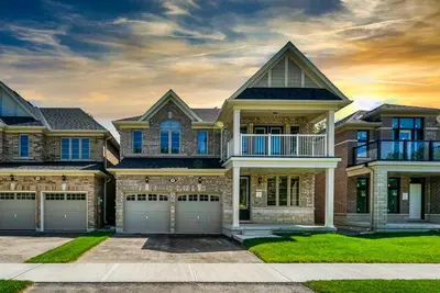 a large house with a garage at Heaven Beach House 2 min walk in Georgina