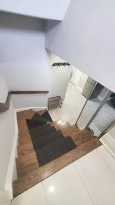 an empty room with a staircase in a building at Cozy Basement Stay in Mississauga in Mississauga