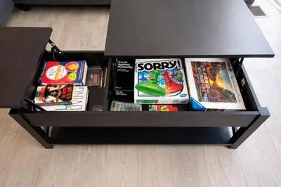 a black box filled with games and video games at Central & Cozy 2BR Townhome with Free Parking, WiFi, Full Kitchen, Laundry, Steps to Strip Plaza & 5 Min Drive to Innisfil Beach Park! Perfect for Work Trips, Family Travel & Couples! in Innisfil