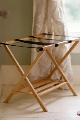 a glass table sitting on top of a wooden stand at Central Picton Apartment, Sleeps 8; The Iron Horse in Picton