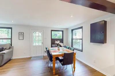 a dining room with a table and chairs at Lazy Daze (House 2) in Wasaga Beach