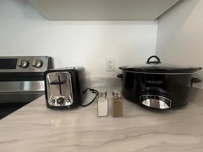a kitchen counter with a toaster and a slow cooker at Upscale Niagara Falls Getaway - BRAND NEW in Niagara Falls