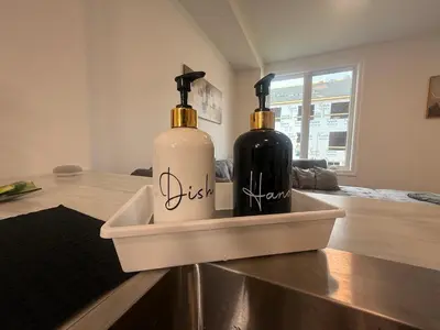 two bottles of wine in a tray on a table at Upscale Niagara Falls Getaway - BRAND NEW in Niagara Falls