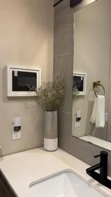 a bathroom with a sink and a mirror at The Artist's Loft in Stratford