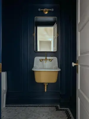 a bathroom with a sink and a mirror at Sun-Filled Century Home in Hamilton