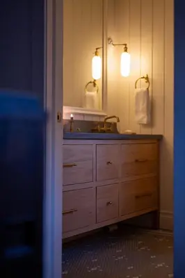 a bathroom with a sink and a mirror at Sun-Filled Century Home in Hamilton