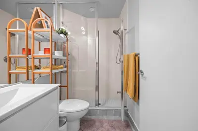 a bathroom with a shower and a toilet and a sink at Charming Studio in Downtown Toronto in Toronto