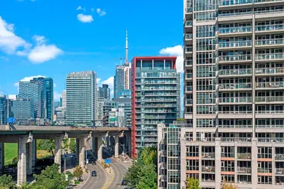 a city skyline with tall buildings and a bridge at Charming Studio in Downtown Toronto in Toronto