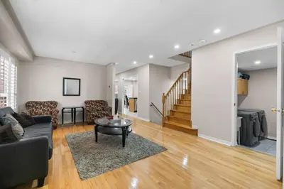 a living room with a couch and a table at Cozy Family Home Netflix Backyard and Quiet Area in Mississauga