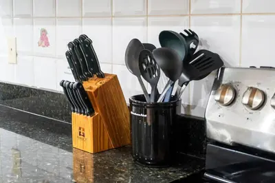 a container of kitchen utensils on a kitchen counter at Cozy Family Home Netflix Backyard and Quiet Area in Mississauga
