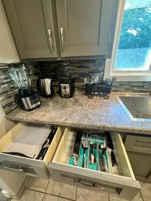 a kitchen with a sink and a counter top at Luxe Living Prime Location in Kitchener