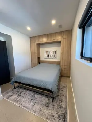 a small bedroom with a bed and a rug at Duncan in Kimberley