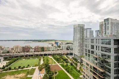 an aerial view of a city with tall buildings at Panoramic Lake View 1 Bedroom plus Den Condo Iceboat Terrace Downtown Toronto in Toronto