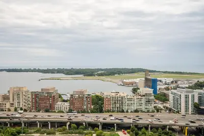 an aerial view of a city with a river and buildings at Panoramic Lake View 1 Bedroom plus Den Condo Iceboat Terrace Downtown Toronto in Toronto