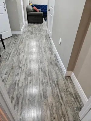 a hallway with wood floors in a house at Beautiful 3 bedrooms, 2 bathrooms, 4 beds sleep 8, basement close to Falls in Niagara Falls