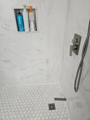 a bathroom with a shower with a sink and a toilet at Beautiful 3 bedrooms, 2 bathrooms, 4 beds sleep 8, basement close to Falls in Niagara Falls