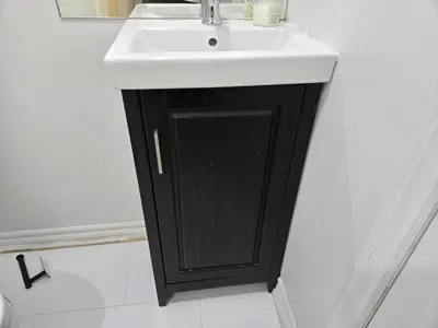 a black and white sink in a bathroom at One Bed basement Room in Brampton