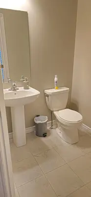 a bathroom with a toilet and a sink at 3BR Townhome Wright Dr Midland Near Little Lake in Midland