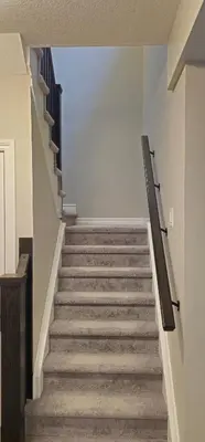 a staircase in a building with a stair case at 3BR Townhome Wright Dr Midland Near Little Lake in Midland