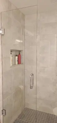 a shower stall with a glass shower door at 3BR Townhome Wright Dr Midland Near Little Lake in Midland