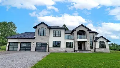 a large house with a large driveway at Lucky Mansion - a Luxury Villa in Fort Erie ! in Fort Erie