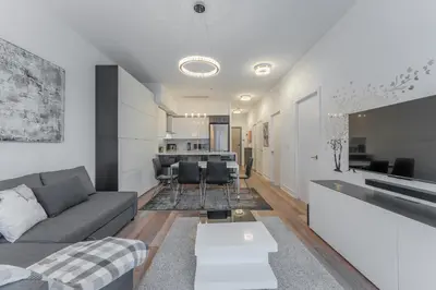 a living room with a couch and a table at Shore Breeze in Toronto