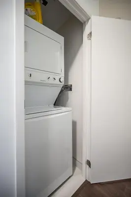 a kitchen with a white stove top oven next to a door at Modern 1 Bedroom Dunfield Ave Apartment in Toronto