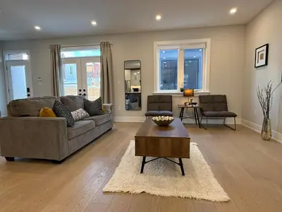 a living room with a couch and a table at Prestige 3BR Luxury Living in Queen West in Toronto