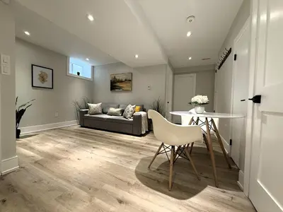 a living room with a couch and a table at Stylish 1BR in Queen West in Toronto