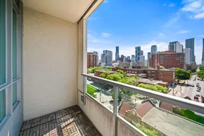 a balcony with a view of the city at Modern 2BR in TO Near Yorkville & the Village in Toronto