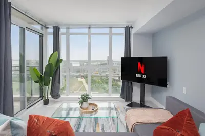 a living room with a tv with the n on it at Toronto Getaway 2BR Condo w City Views in Toronto