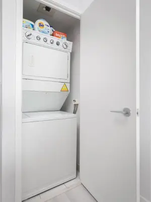 a kitchen with a white stove and an open door at Toronto Getaway 2BR Condo w City Views in Toronto