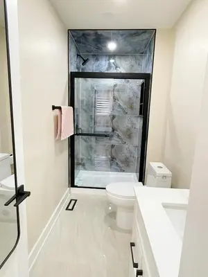 a bathroom with a shower and a toilet at 3 Bedroom Home Peaceful & Trendy in Brampton