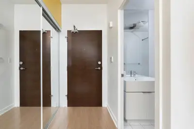a bathroom with a shower and a sink and a mirror at Modern Waterfront Comfort Condo with City Views in Toronto