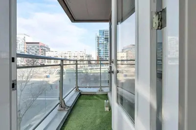 a balcony with a view of a city at Modern Waterfront Comfort Condo with City Views in Toronto