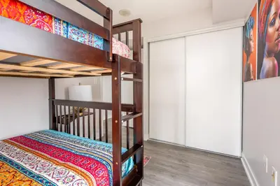 a bedroom with two bunk beds in a room at Corner 2 Bedroom 2 Bathroom Condo Balcony Iceboat Terrace Downtown Toronto in Toronto