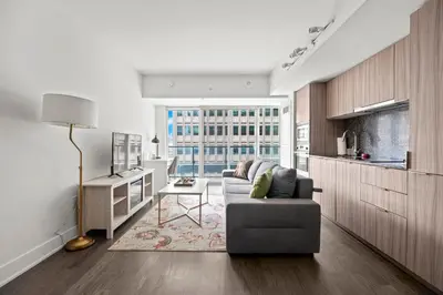 a living room with a couch and a table at Modern 1BD Apartment with Balcony DT Toronto in Toronto