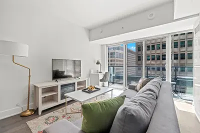 a living room with a couch and a tv at Modern 1BD Apartment with Balcony DT Toronto in Toronto