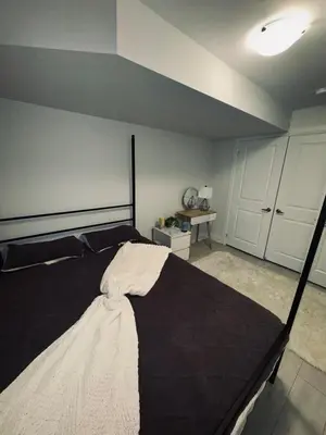 a bedroom with a large bed in a room at Entire unit seprate entrance in Richmond Hill