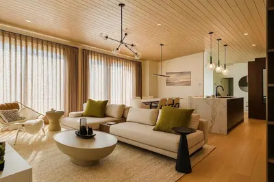 a living room with a couch and a table at Stoney Lake Cottage with Private Dock by Leavetown Vacations in Crowes Landing