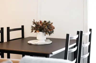 a table with a vase with a plant on it at Spacious Toronto Condo w Patio - City Comfort in Toronto