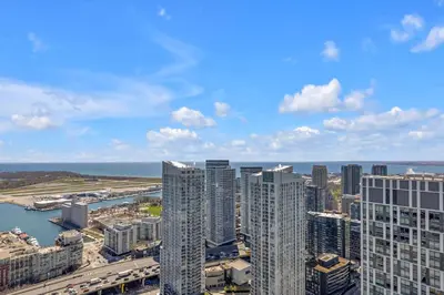 an aerial view of a city with tall buildings at Sky-High Penthouse Breathtaking City Views in Toronto